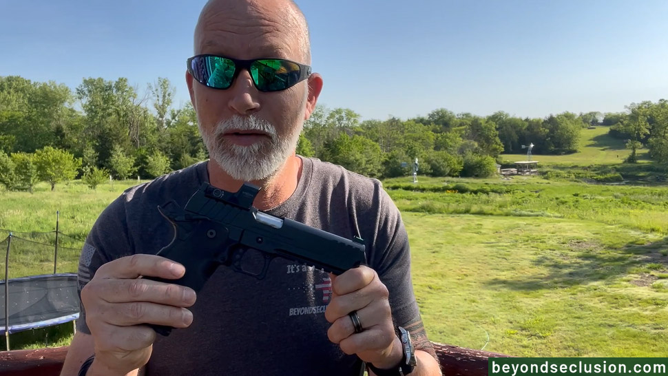 A Man Holding the Springfield Prodigy 9mm Handgun